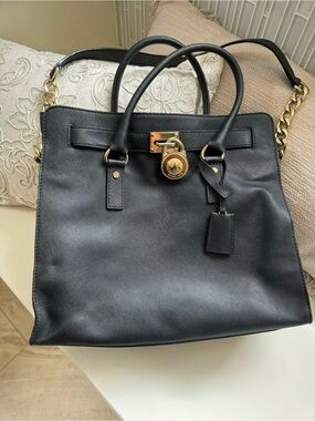 Michael Kors Black Leather Satchel with Gold-Tone Lock and Chain Strap